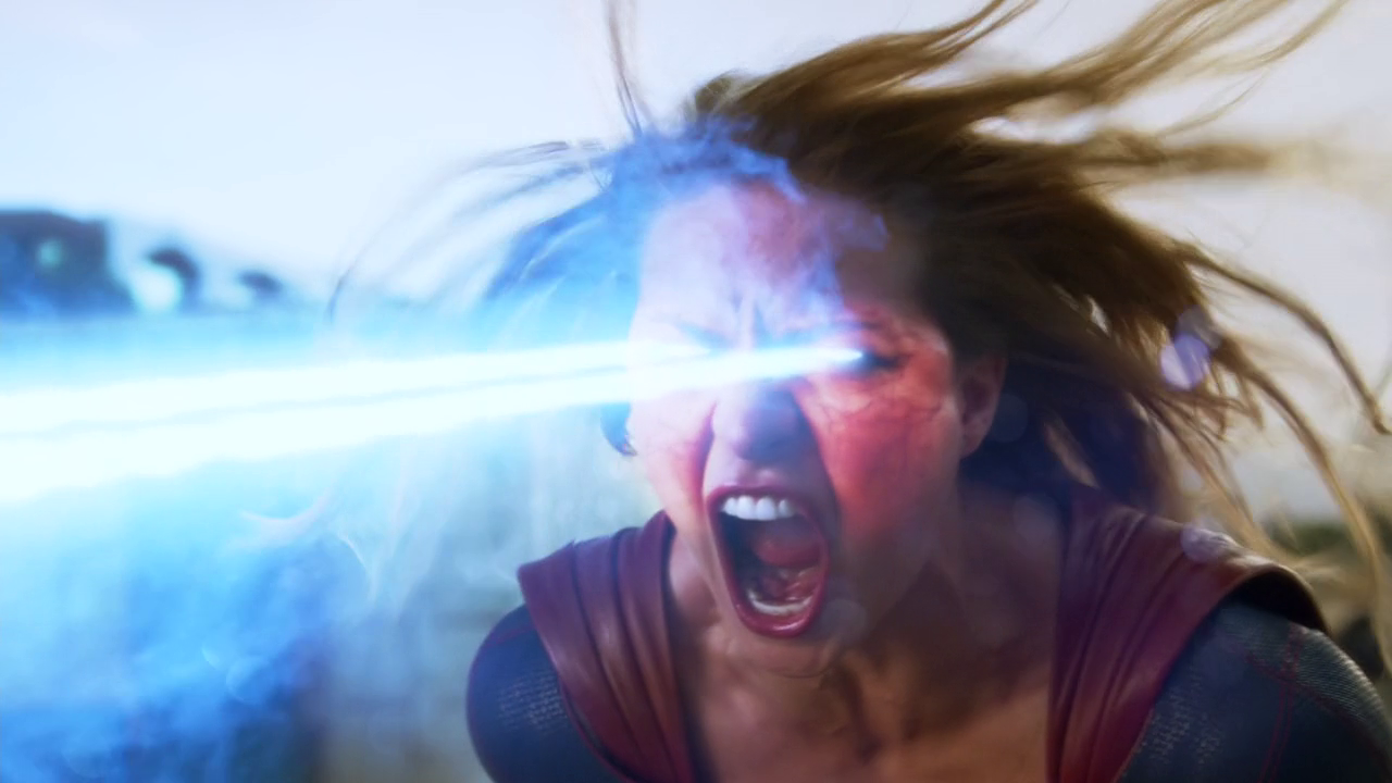 Supergirl_angrily_firing_a_blast_of_heat_vision_at_Red_Tornado.png